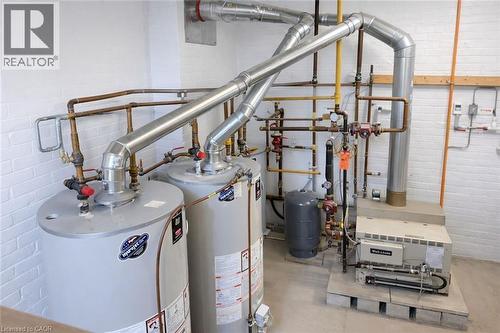 Utility room with water heater - 17 Louisa Street, Kitchener, ON - Indoor Photo Showing Basement