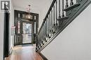 Foyer featuring stairs, a baseboard radiator, and light wood-type flooring - 14 Forest Avenue, Hamilton, ON  - Indoor Photo Showing Other Room 