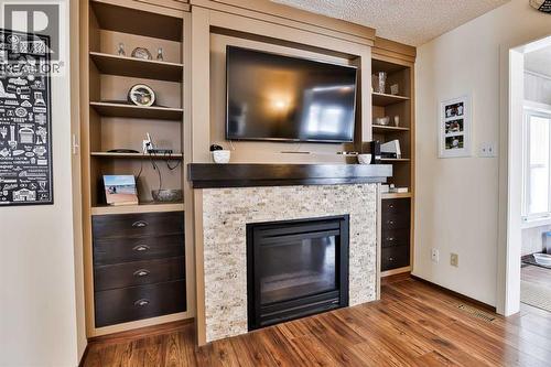 1813 Elm Road S, Lethbridge, AB - Indoor Photo Showing Living Room With Fireplace