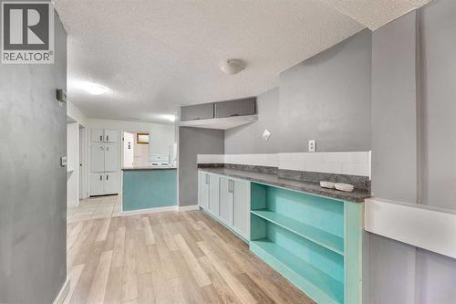 Kitchen - 4908 23 Avenue Nw, Calgary, AB - Indoor Photo Showing Other Room