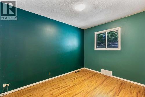 Primary bedroom - 4908 23 Avenue Nw, Calgary, AB - Indoor Photo Showing Other Room
