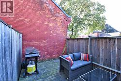 Deck with a grill and an outdoor hangout area - 