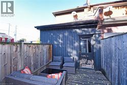 Wooden terrace with an outdoor hangout area - 