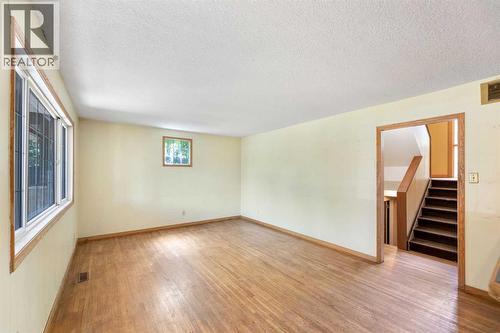 Living room - 155 35 Street Nw, Calgary, AB - Indoor Photo Showing Other Room
