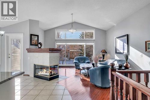 78 Mckenzie Lake Place Se, Calgary, AB - Indoor Photo Showing Other Room With Fireplace