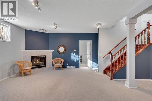 78 Mckenzie Lake Place Se, Calgary, AB - Indoor Photo Showing Other Room With Fireplace