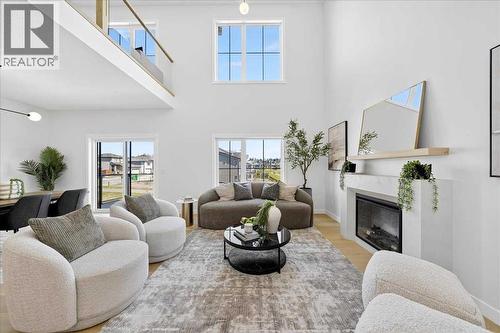 Living room - 7 Lakewood Point, Strathmore, AB - Indoor Photo Showing Living Room With Fireplace