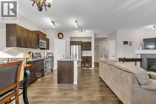 31 Walden Court Se, Calgary, AB - Indoor Photo Showing Kitchen With Fireplace With Stainless Steel Kitchen With Upgraded Kitchen