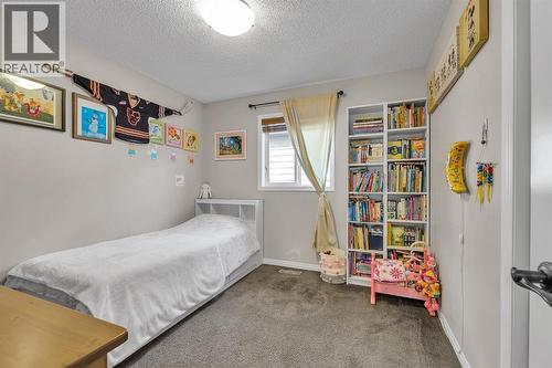 31 Walden Court Se, Calgary, AB - Indoor Photo Showing Bedroom
