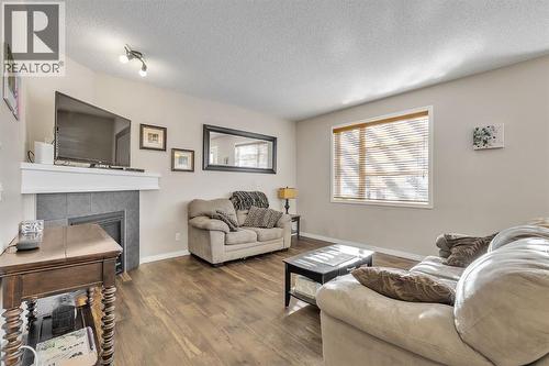 31 Walden Court Se, Calgary, AB - Indoor Photo Showing Living Room With Fireplace