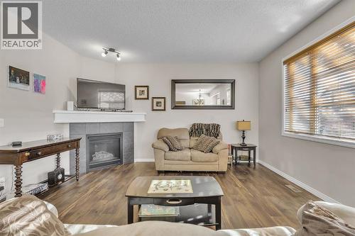 31 Walden Court Se, Calgary, AB - Indoor Photo Showing Living Room With Fireplace