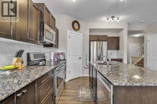 31 Walden Court Se, Calgary, AB - Indoor Photo Showing Kitchen With Double Sink With Upgraded Kitchen