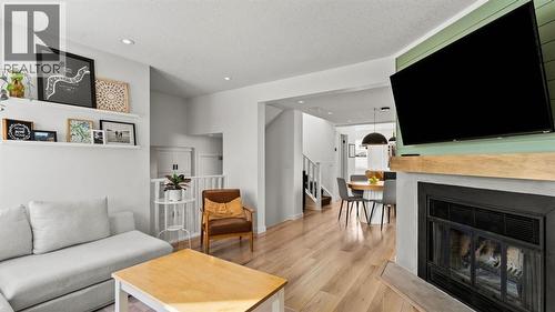 161 Macewan Glen Drive Nw, Calgary, AB - Indoor Photo Showing Living Room With Fireplace