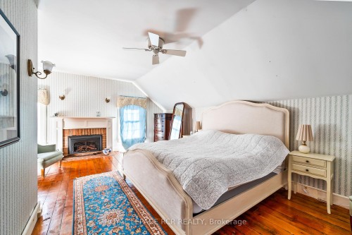 6000 Eighth Line, Erin, ON - Indoor Photo Showing Bedroom With Fireplace