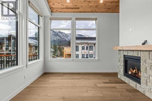 407, 1505 Spring Creek Gate, Canmore, AB - Indoor With Fireplace