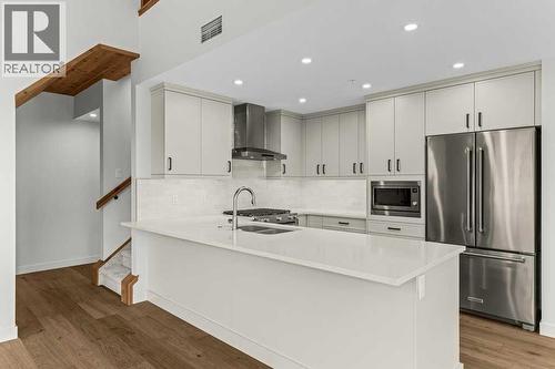 407, 1505 Spring Creek Gate, Canmore, AB - Indoor Photo Showing Kitchen With Double Sink With Upgraded Kitchen