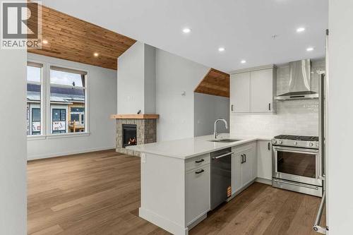 407, 1505 Spring Creek Gate, Canmore, AB - Indoor Photo Showing Kitchen With Upgraded Kitchen