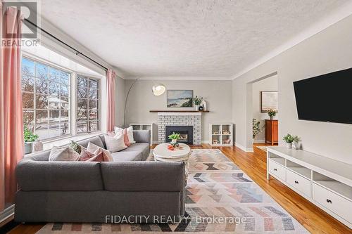 758 Smyth Road, Ottawa, ON - Indoor Photo Showing Living Room With Fireplace