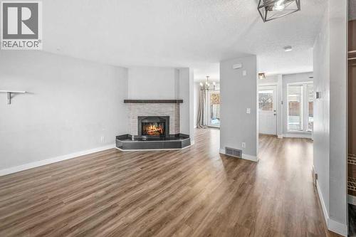 2140 146 Avenue Se, Calgary, AB - Indoor Photo Showing Living Room With Fireplace
