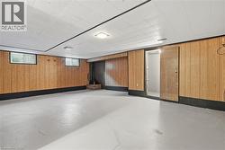 Below grade area featuring wooden walls - 