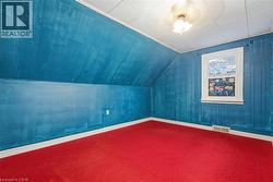 Bonus room with lofted ceiling and carpet flooring - 