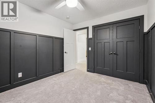47 Sundown Way, Cochrane, AB - Indoor Photo Showing Other Room