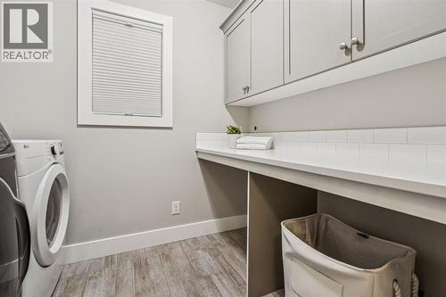 47 Sundown Way, Cochrane, AB - Indoor Photo Showing Laundry Room