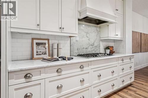 47 Sundown Way, Cochrane, AB - Indoor Photo Showing Kitchen With Upgraded Kitchen