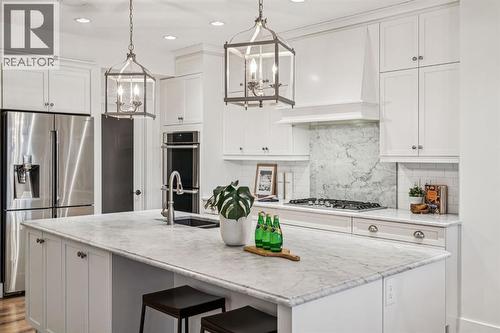 47 Sundown Way, Cochrane, AB - Indoor Photo Showing Kitchen With Upgraded Kitchen