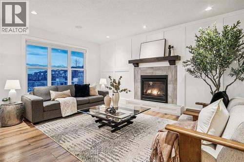 47 Sundown Way, Cochrane, AB - Indoor Photo Showing Living Room With Fireplace