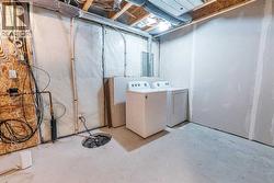 oversized laundry/utility/storage room in basement - 