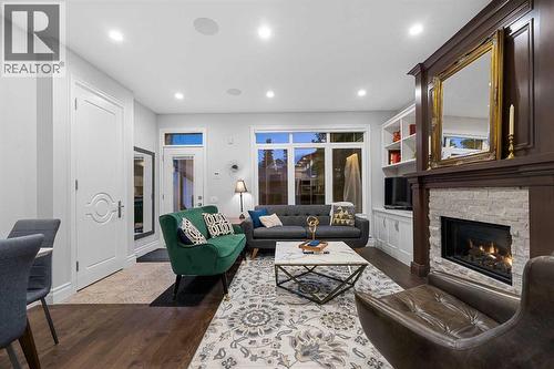 922 5 Street Nw, Calgary, AB - Indoor Photo Showing Living Room With Fireplace