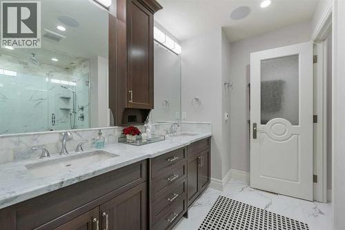 Primary ensuite w/ heated tile, private water closet, and more custom millwork - 922 5 Street Nw, Calgary, AB - Indoor Photo Showing Bathroom
