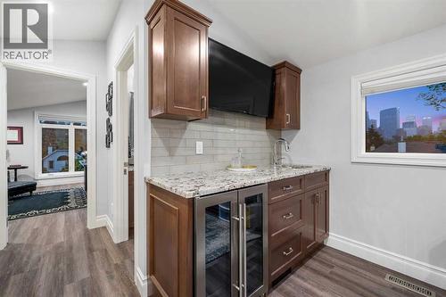 Wet bar and half bath on loft level - 922 5 Street Nw, Calgary, AB - Indoor Photo Showing Other Room