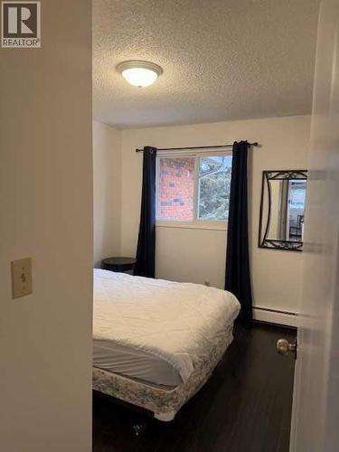 202, 11114 Hoppe, Grande Cache, AB - Indoor Photo Showing Bedroom