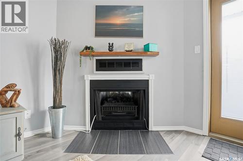 164 Cedar Meadow Drive, Regina, SK - Indoor Photo Showing Other Room With Fireplace