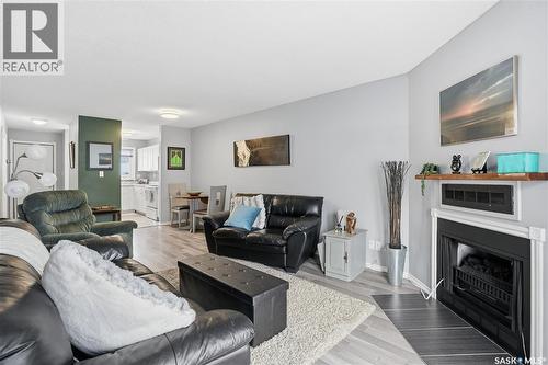 164 Cedar Meadow Drive, Regina, SK - Indoor Photo Showing Living Room With Fireplace