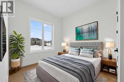 Virtually Staged - 32 Lakes Estates Circle, Strathmore, AB - Indoor Photo Showing Bedroom