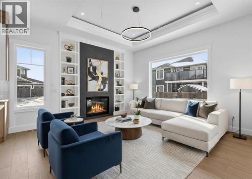 Virtually Staged - 32 Lakes Estates Circle, Strathmore, AB - Indoor Photo Showing Living Room With Fireplace