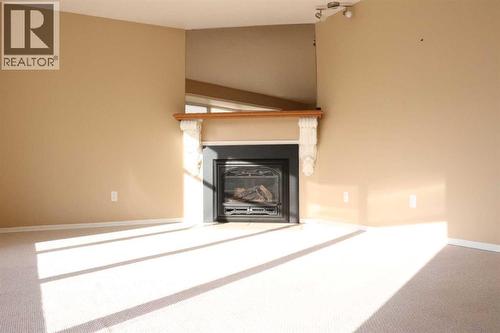 164 Mt Crandell Crescent W, Lethbridge, AB - Indoor With Fireplace