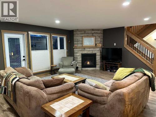 67 Ironstone Drive, Coleman, AB - Indoor Photo Showing Living Room With Fireplace