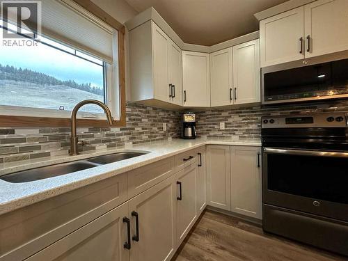 67 Ironstone Drive, Coleman, AB - Indoor Photo Showing Kitchen With Double Sink