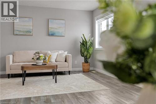 Living area with wood finished floors and baseboards - 492 Wismer Street, Waterloo, ON - Indoor