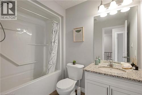 Bathroom with vanity and shower / bath combination with curtain - 492 Wismer Street, Waterloo, ON - Indoor Photo Showing Bathroom