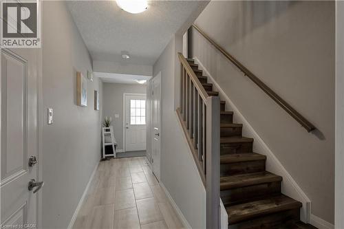 Entryway featuring a textured ceiling and stairs - 492 Wismer Street, Waterloo, ON - Indoor Photo Showing Other Room