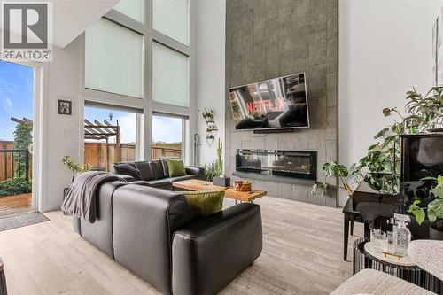 668 Aquitania Boulevard W, Lethbridge, AB - Indoor Photo Showing Living Room With Fireplace