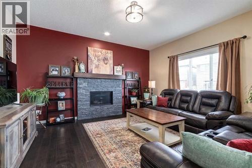 26 Mount Rae Terrace, Okotoks, AB - Indoor Photo Showing Living Room With Fireplace