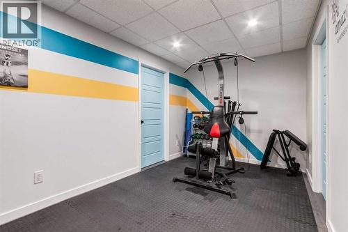 26 Mount Rae Terrace, Okotoks, AB - Indoor Photo Showing Gym Room