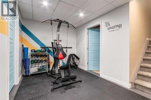 26 Mount Rae Terrace, Okotoks, AB - Indoor Photo Showing Gym Room