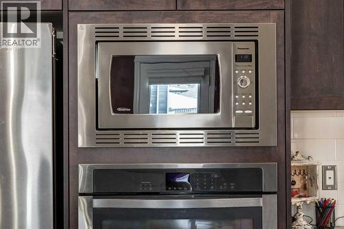 26 Mount Rae Terrace, Okotoks, AB - Indoor Photo Showing Kitchen With Stainless Steel Kitchen